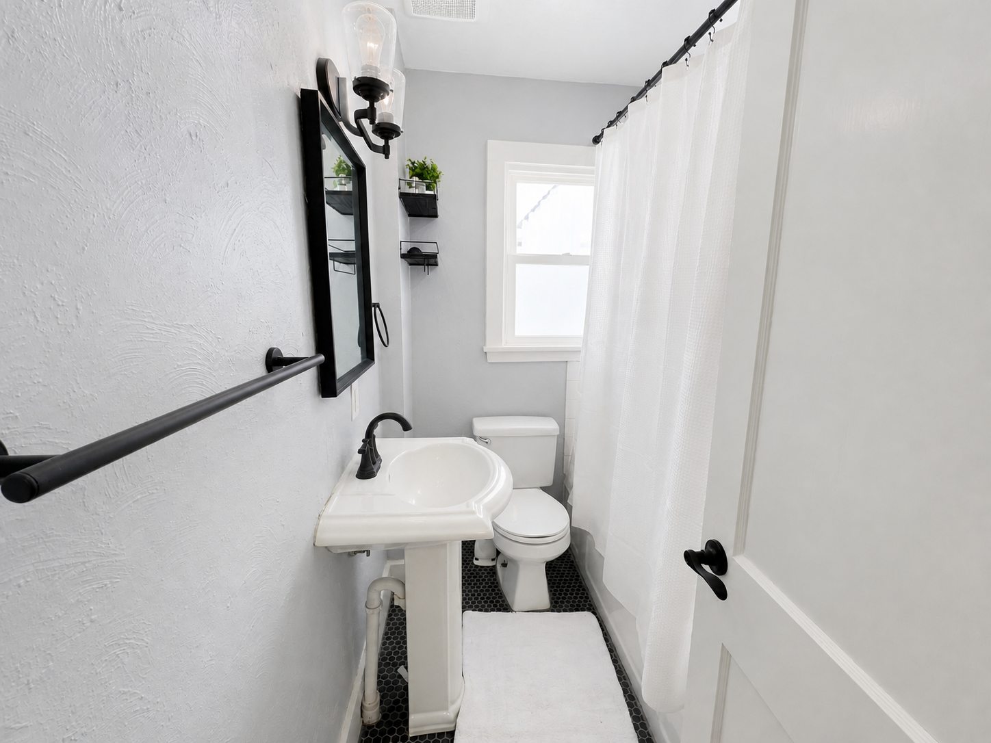 Updated lower-home bathroom with tub and shower