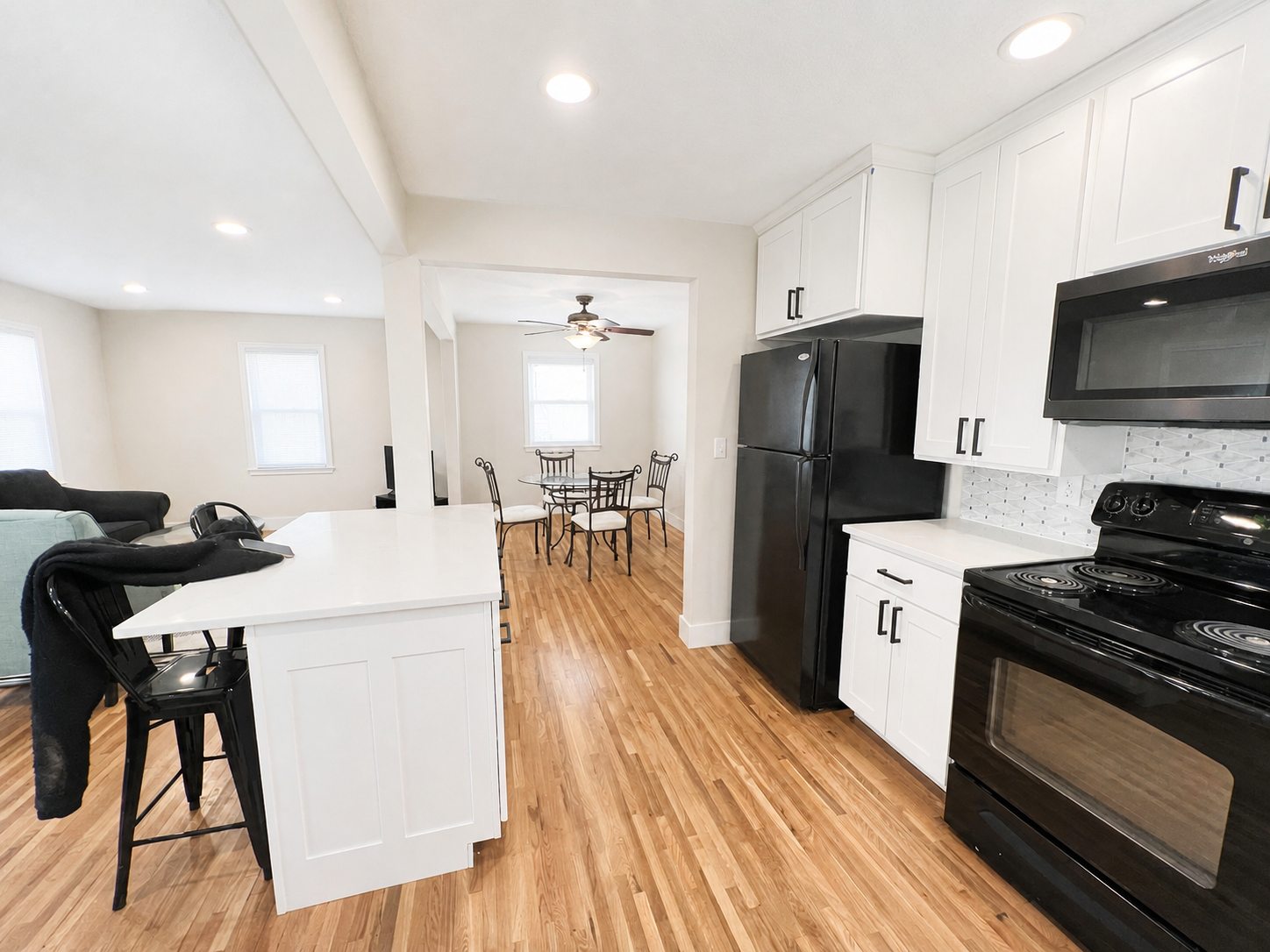Lower-home kitchen island and open dining area