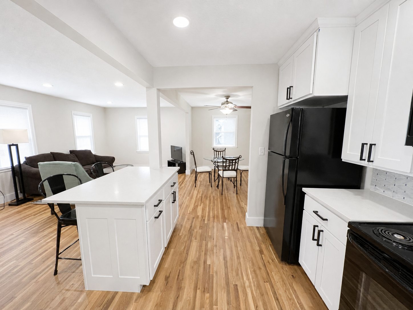 Open-concept lower home viewed from the kitchen