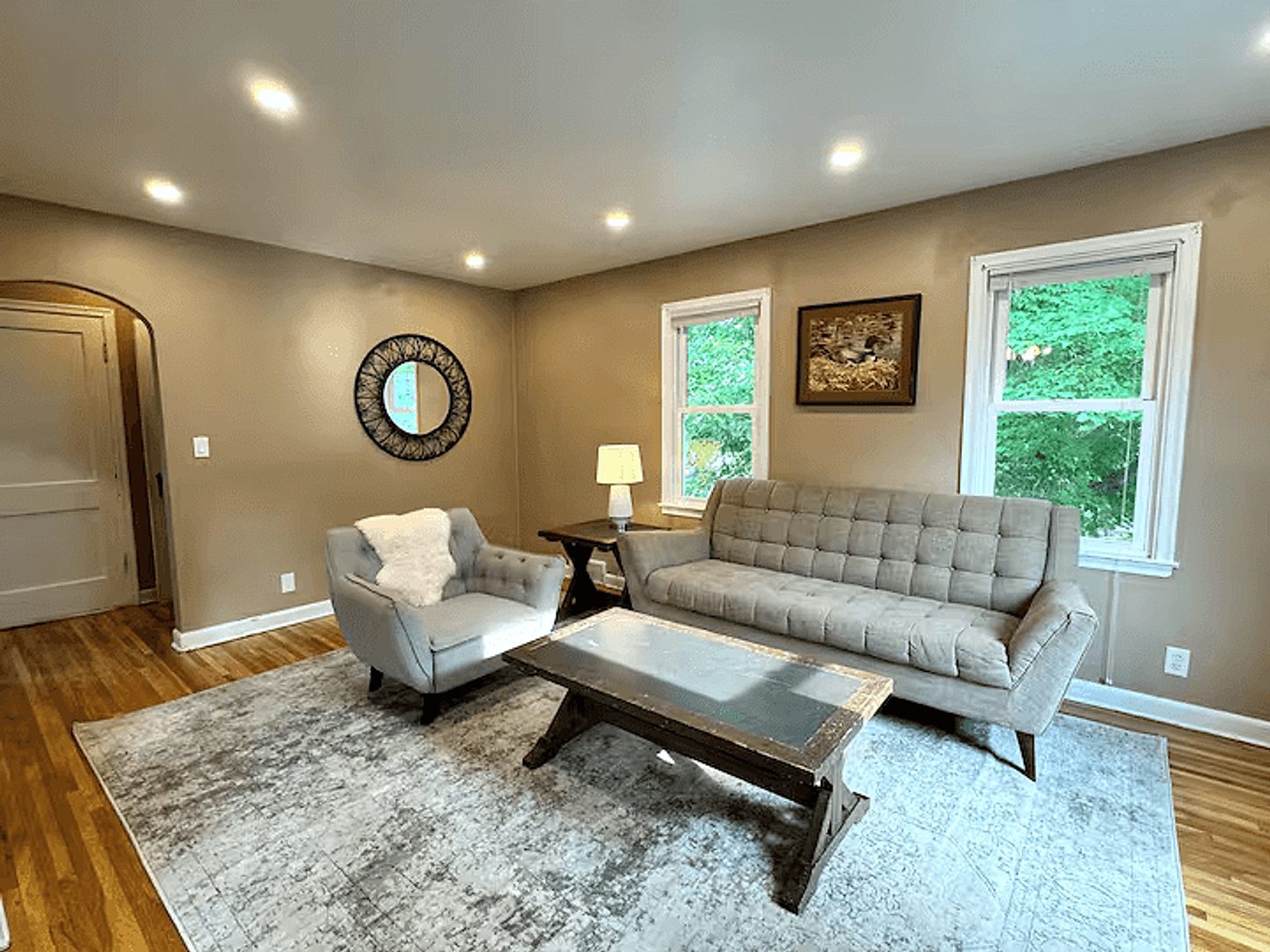 Wide view of the furnished upper-home living room