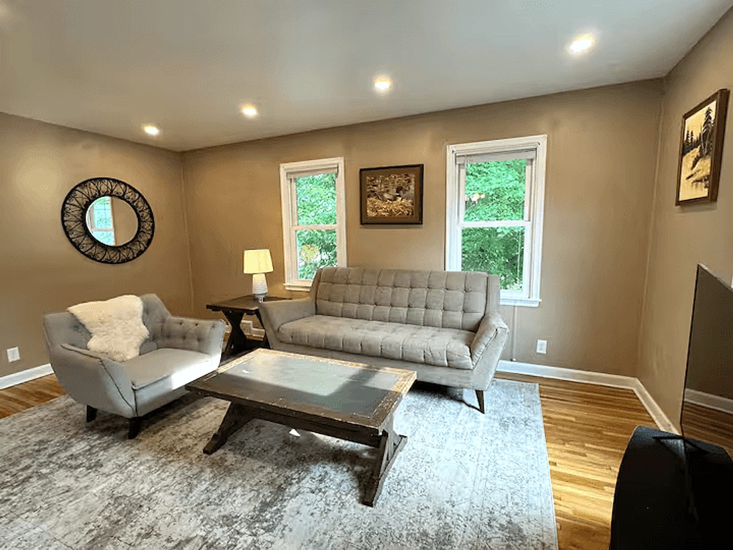 Comfortable seating and hardwood floors in the upper home