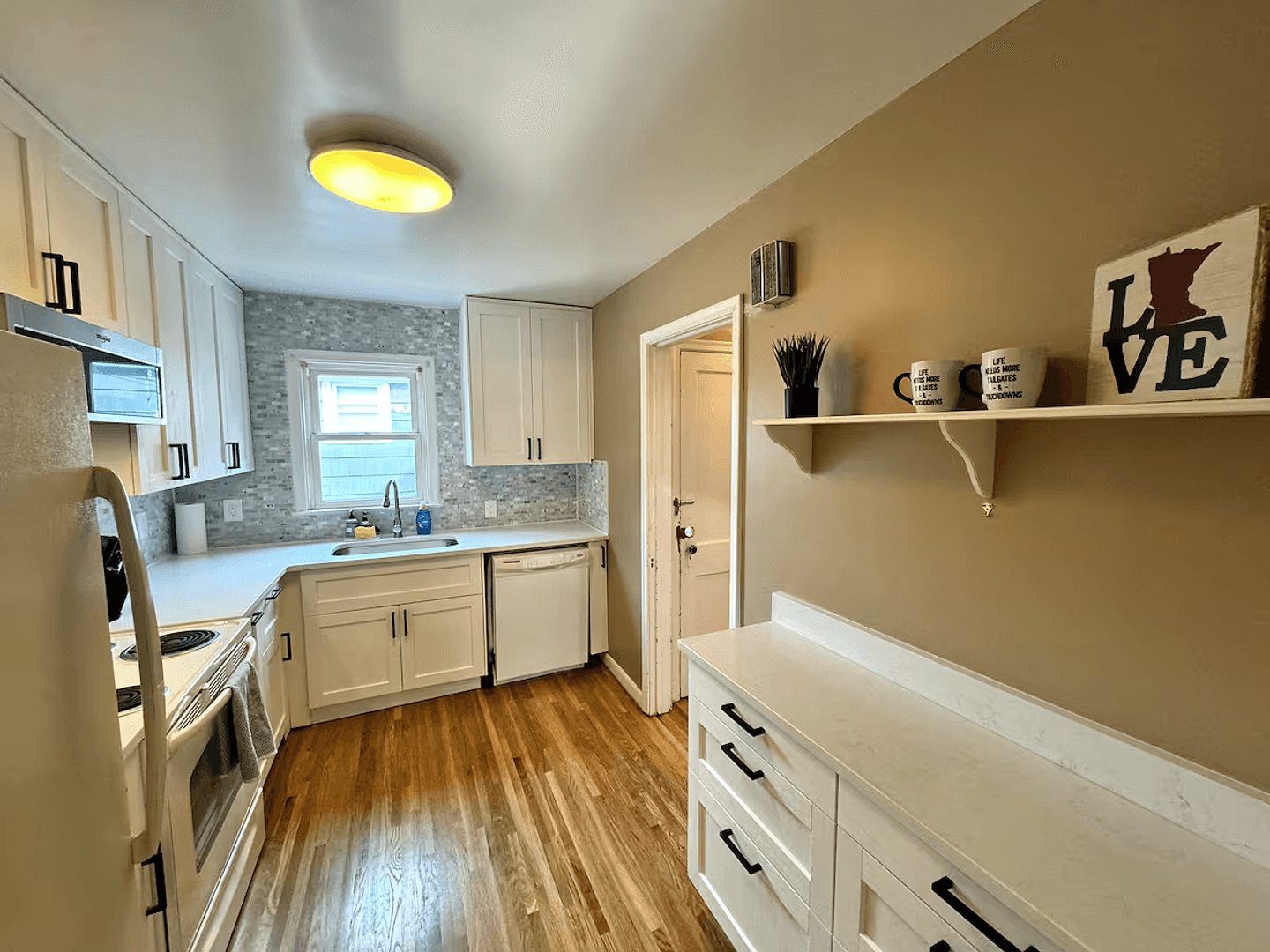 Updated full kitchen in the upper home
