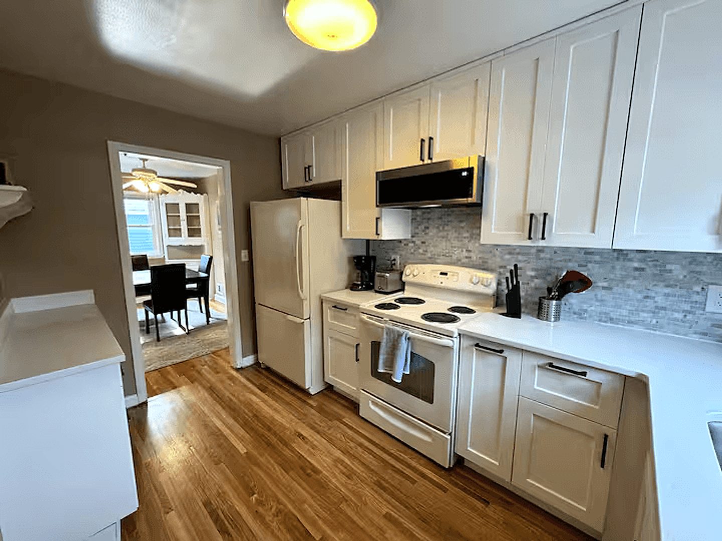 Upper-home kitchen viewed toward the dining room