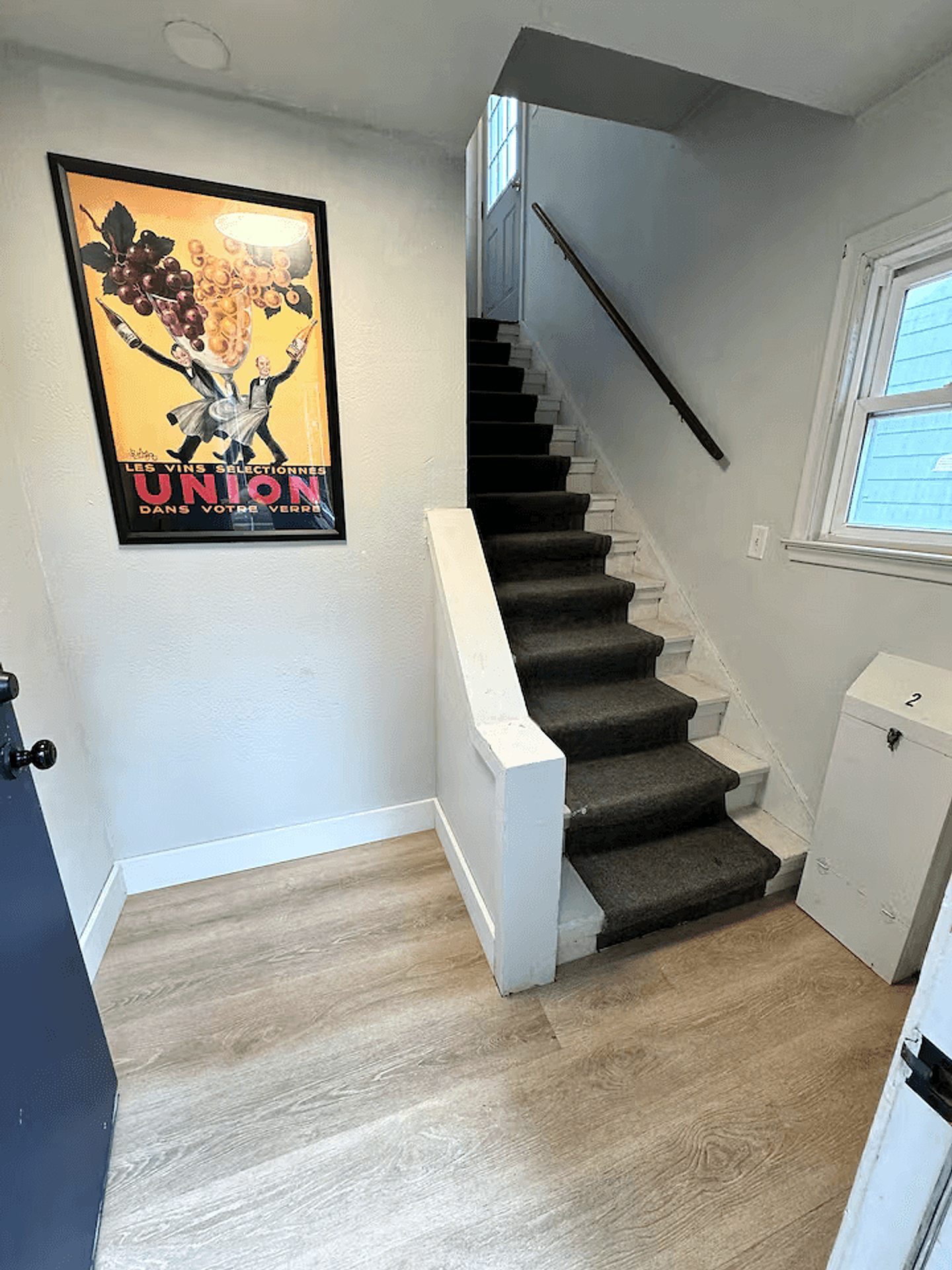 Private entry stairway leading to the upper home